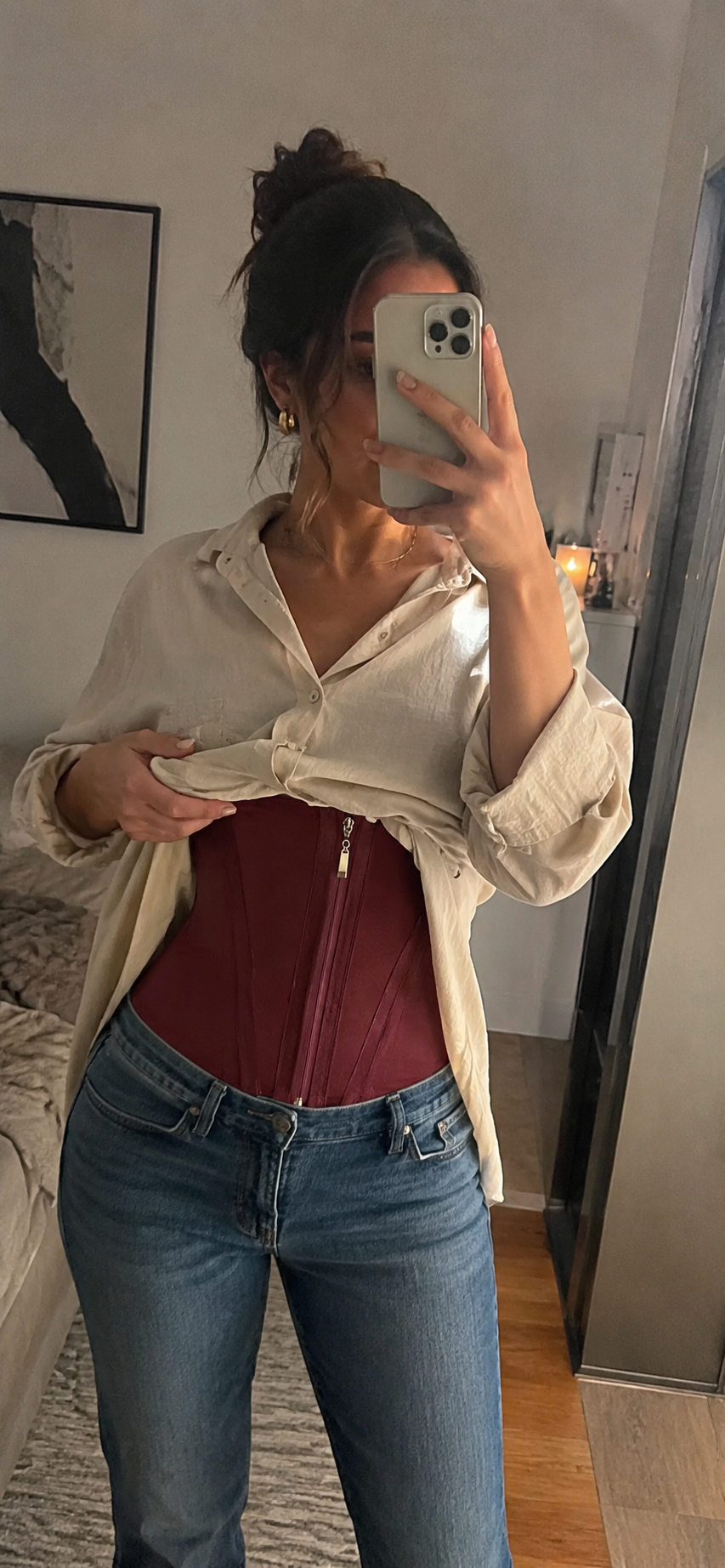 Natalie C. wearing the burgundy ZENTRA corset in a mirror selfie